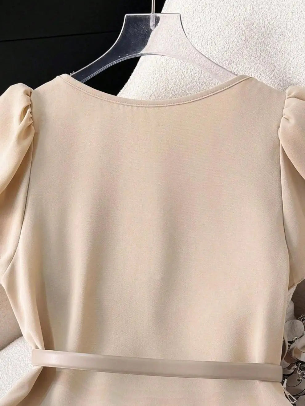 Women's Light Beige Lotus leaf sleeves Top with Deep V-Neck and Shoulder Ruffles Paired with a Light Gray Belt and Gold Buckle