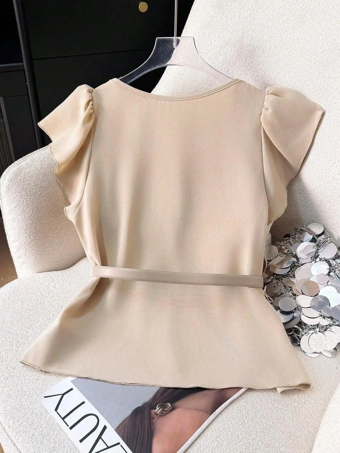 Women's Light Beige Lotus leaf sleeves Top with Deep V-Neck and Shoulder Ruffles Paired with a Light Gray Belt and Gold Buckle